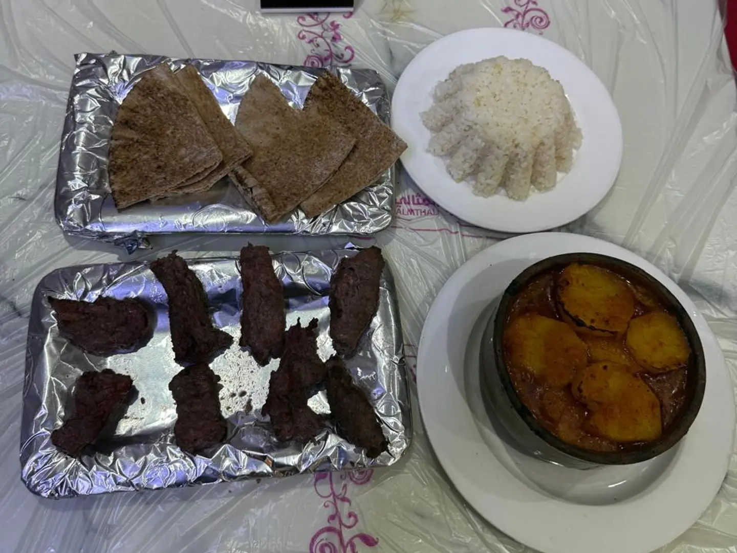 Tayyibat Meal Meat Chunks Potatoes White Rice And A Loaf Of Bread