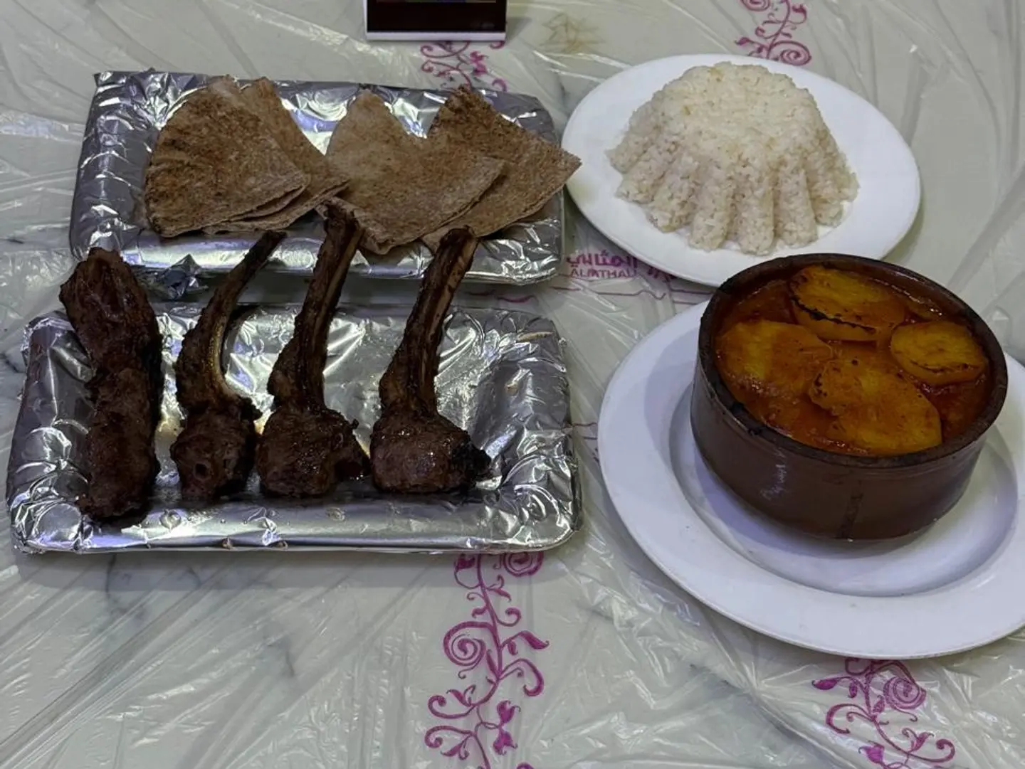 Tayyibat Meal Grilled Lamb Chops Potatoes White Rice And A Loaf Of Bread