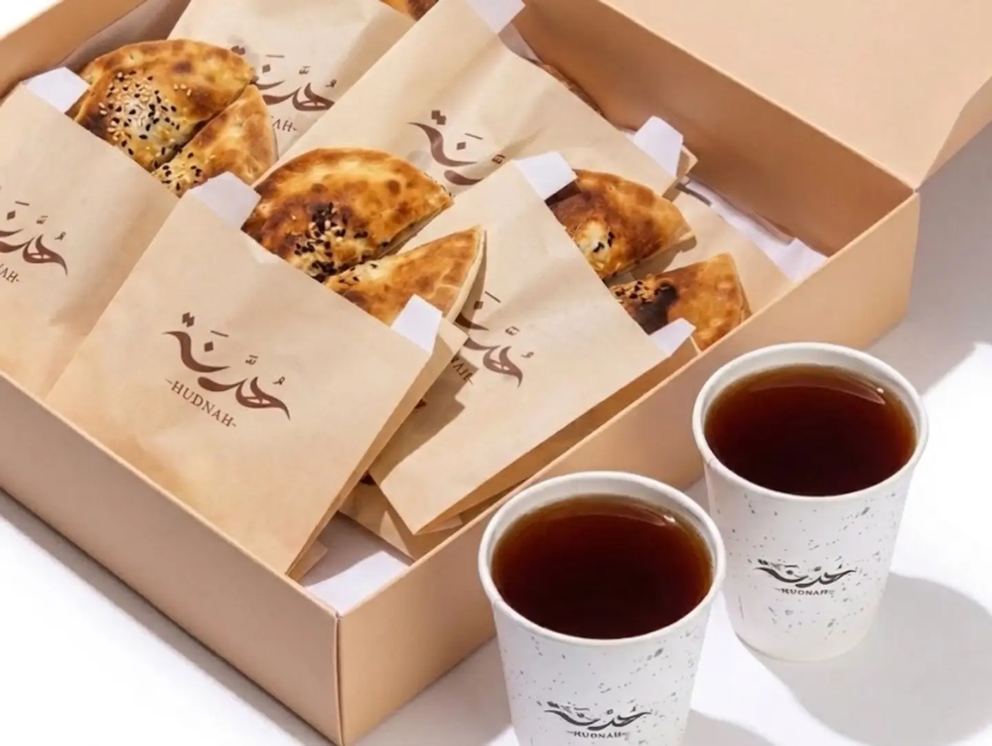 Box Of Pastries And Two Cups Of Tea