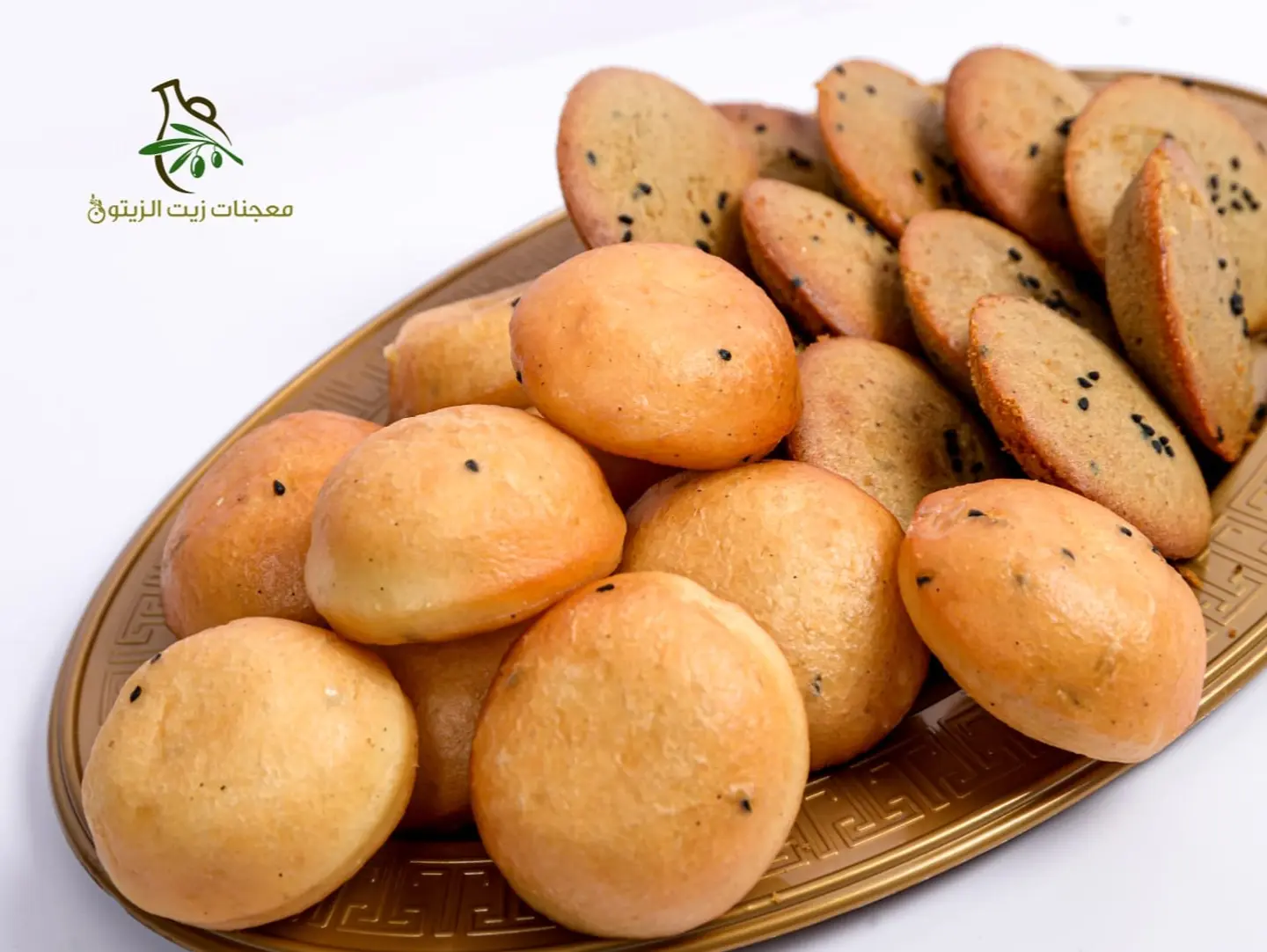 Fluffy Millet Cake Pieces With Dates And Black Seed, Paired With Golden Bakhamri Fried Bread With Black Seed And Stuffed With Kraft Cream Cheese. - Fluffy Millet Cake Pieces With Dates And Black Seed, Paired With Golden Bakhamri Fried Bread With Black Seed And Stuffed With Kraft Cream Cheese.