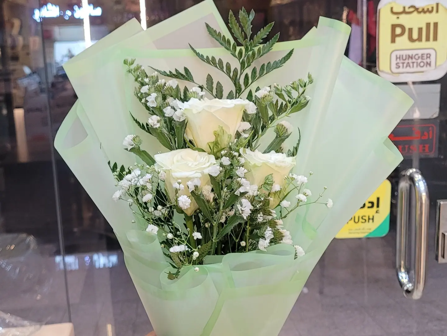 National Day Bouquet With Two Helium Balloons One White And One Green.