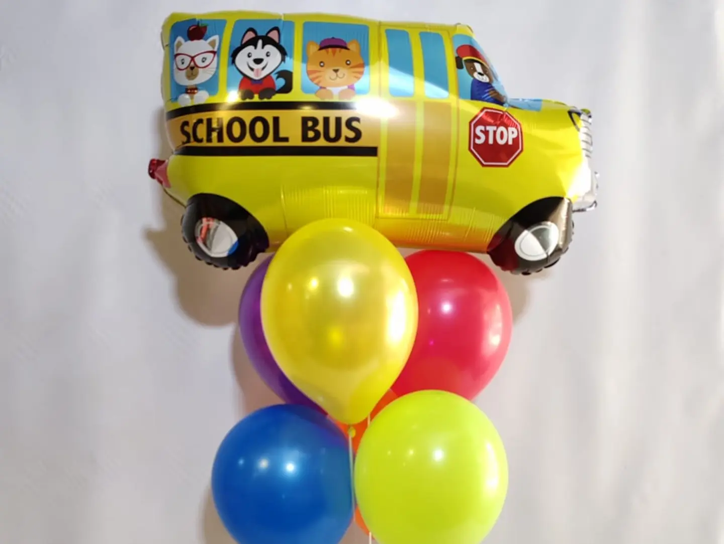 Bouquet Balloons, Including One Shaped Like A School Bus.