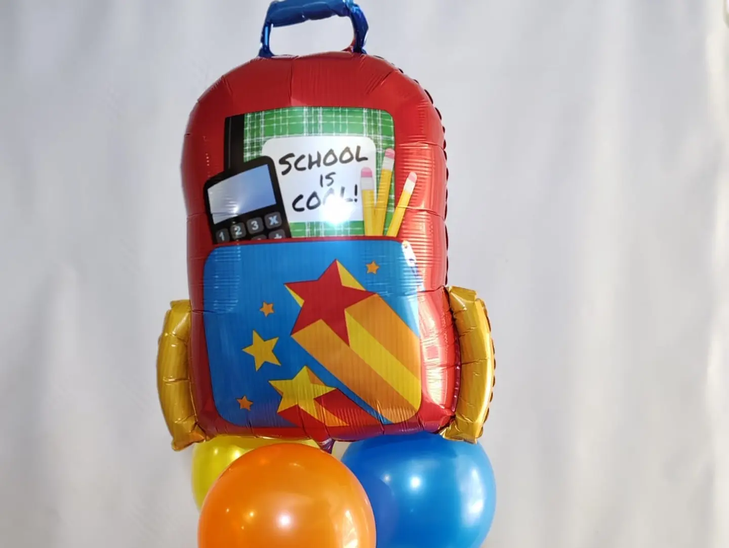 A Set Of Balloons With A School Bag Balloon