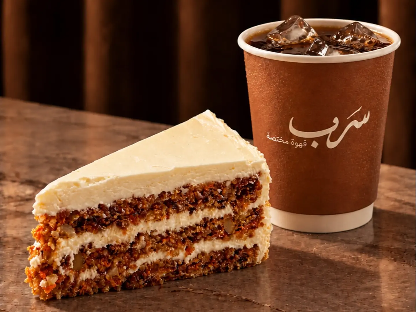 قهوة اليوم بارد كبير و تشيز كيك الجزر