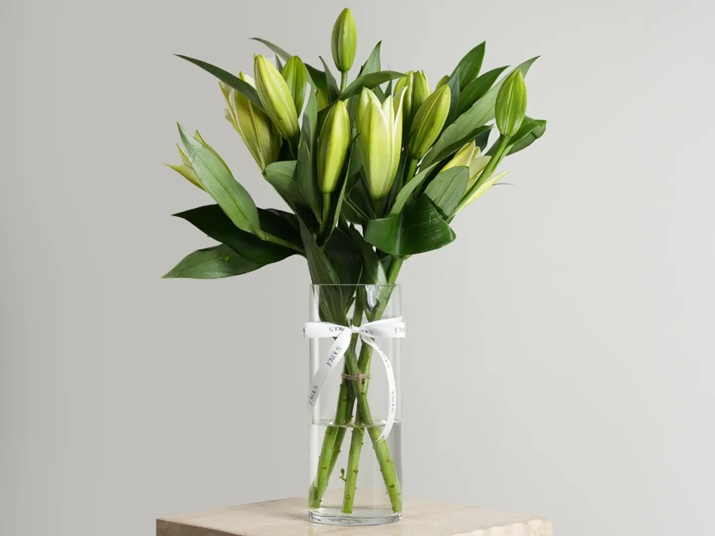 Sukoon Is An Elegant Vase Arrangement Featuring Delicate White Casablanca Lilies, Designed To Reflect Calmness And Purity. A Refined And Minimal Design That Adds A Sophisticated, Serene Touch To Any Space, Making It A Perfect Gift For Special Occasions.
