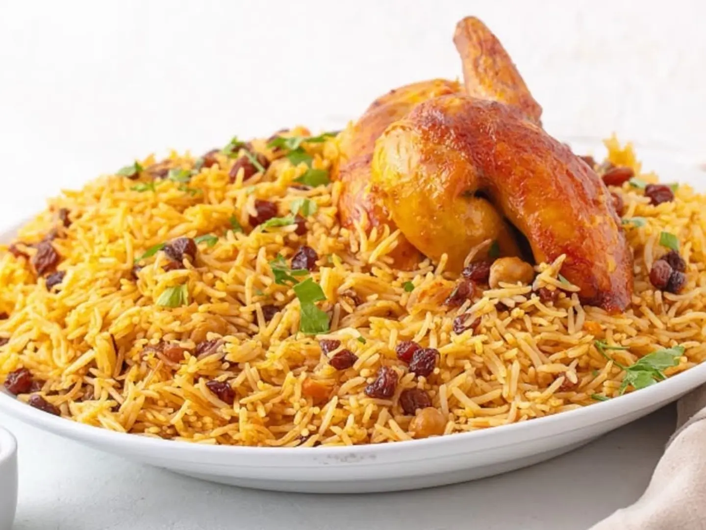 A Quarter Of A Grilled Chicken With Rice