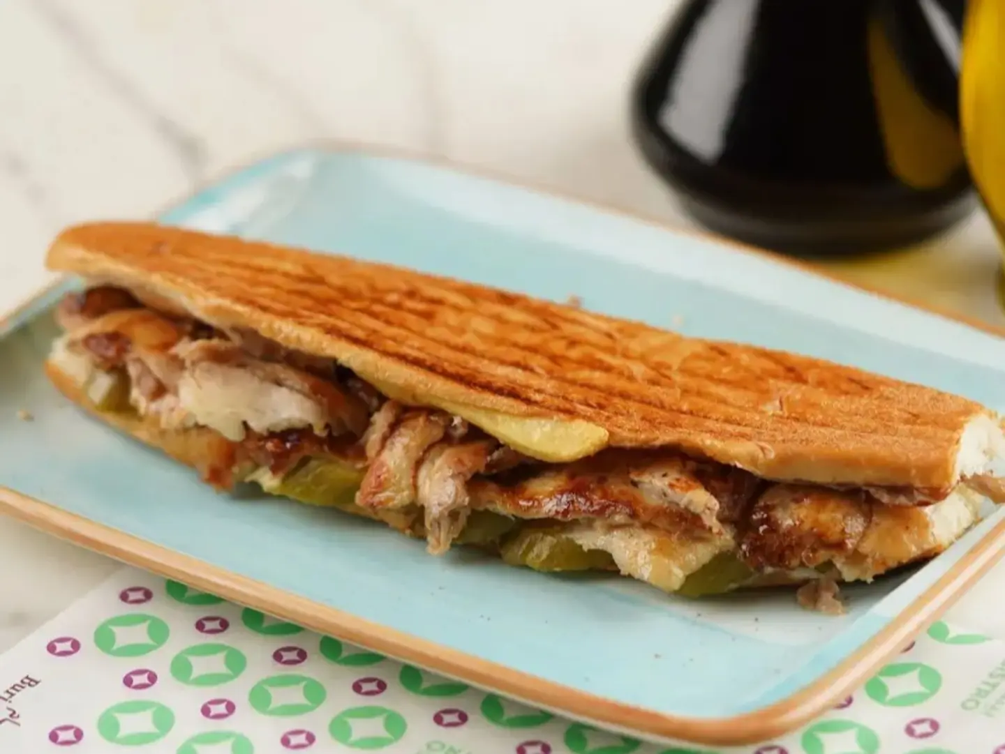 Old School Style Shawarma In A Samoli Roll, Served With Tabbouleh.
