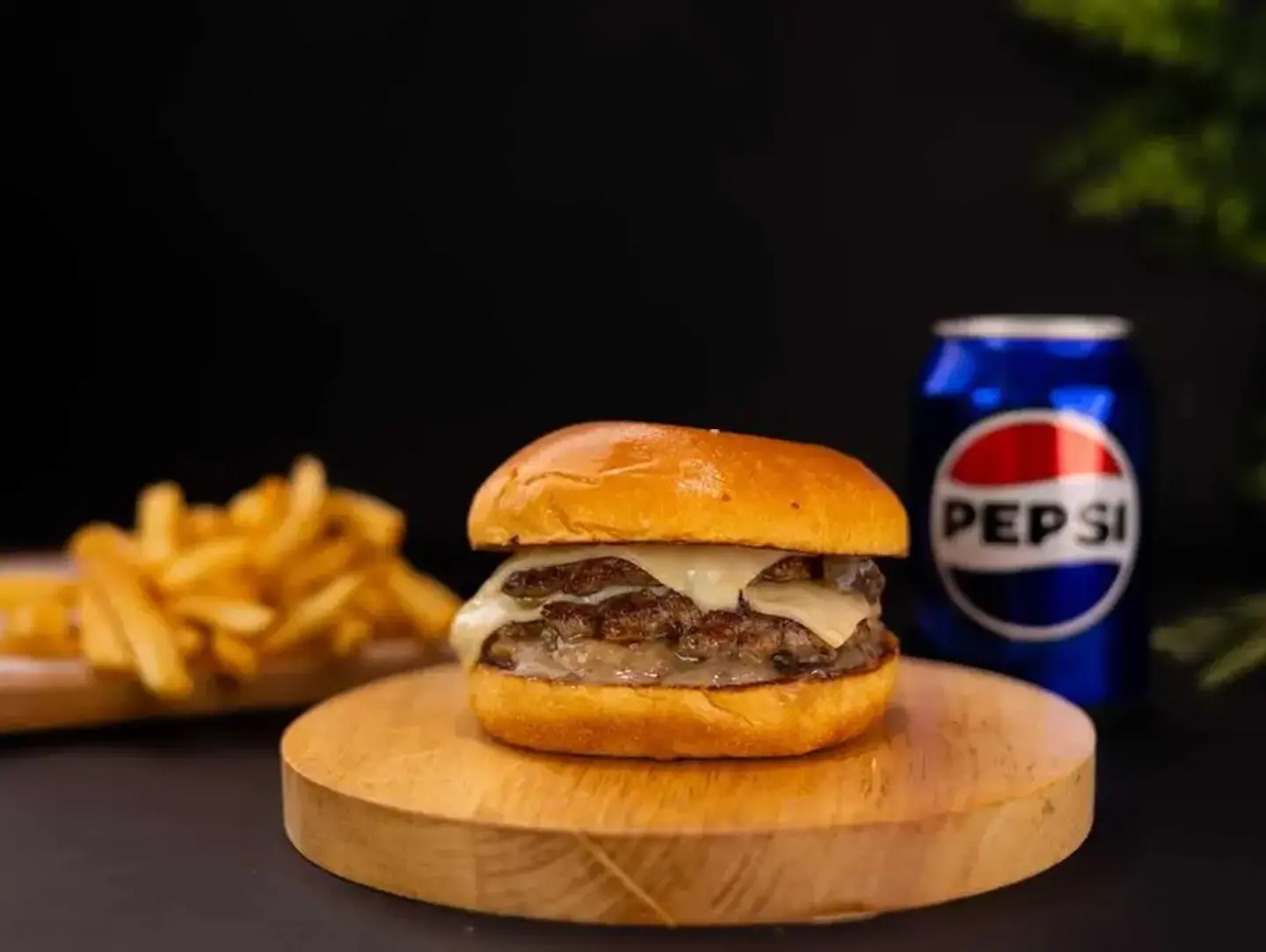Grilled Beef Burger Meal With A Drink And Fries.