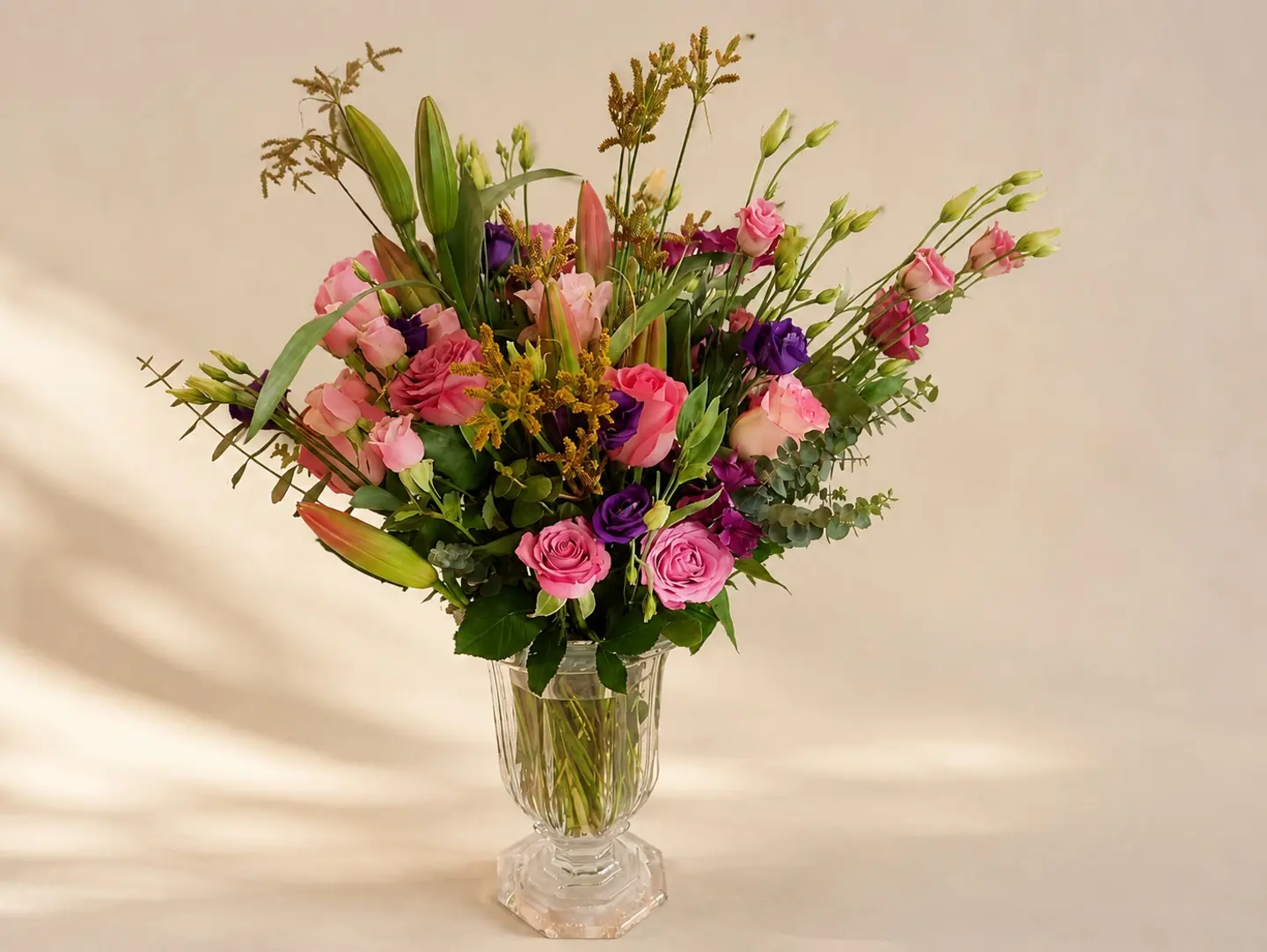 A Bouquet Of Roses In A Transparent Vase