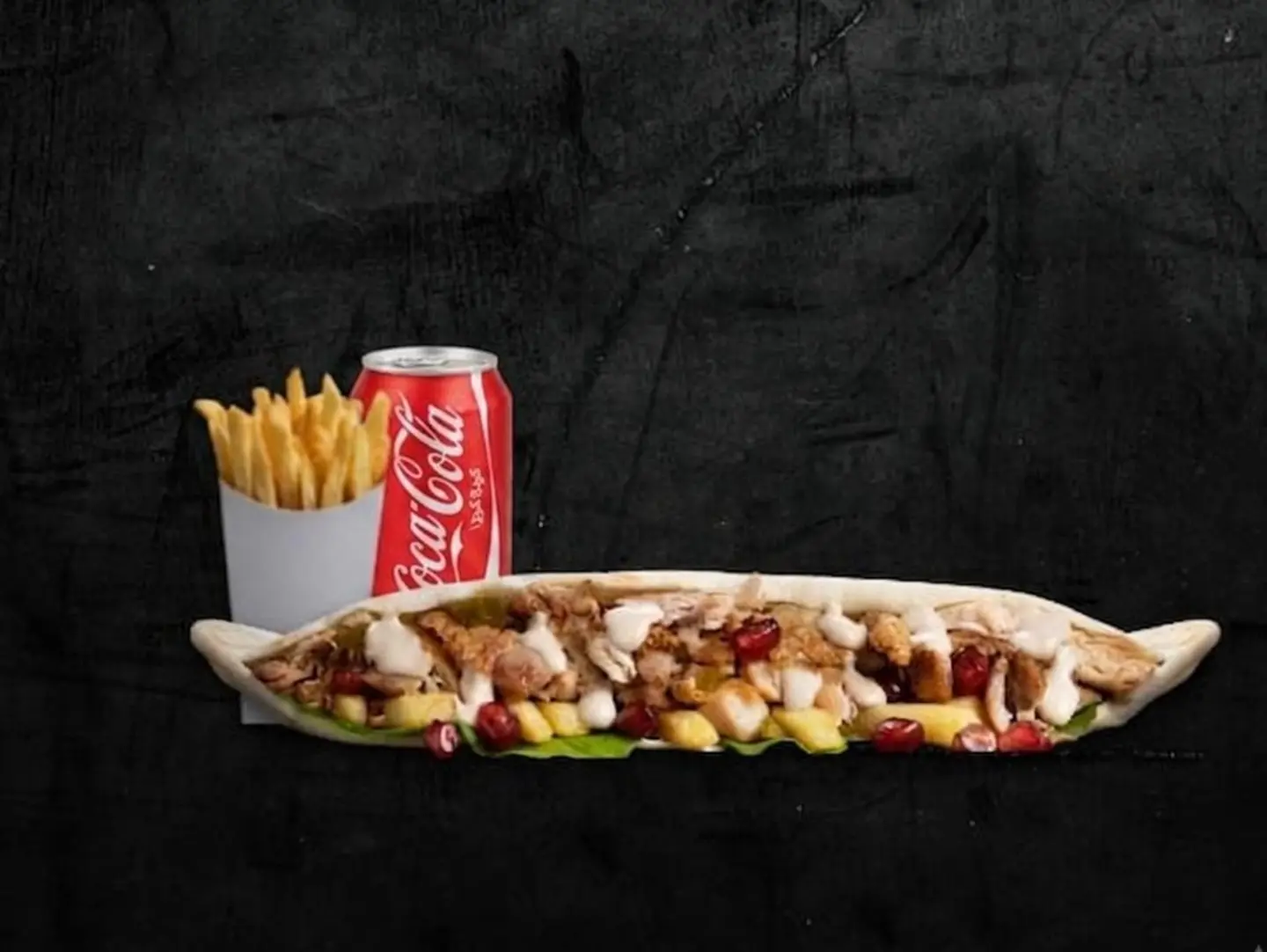 Meal Madhbi Samoon Sandwich With Crispy Fries And A Soft Drink.