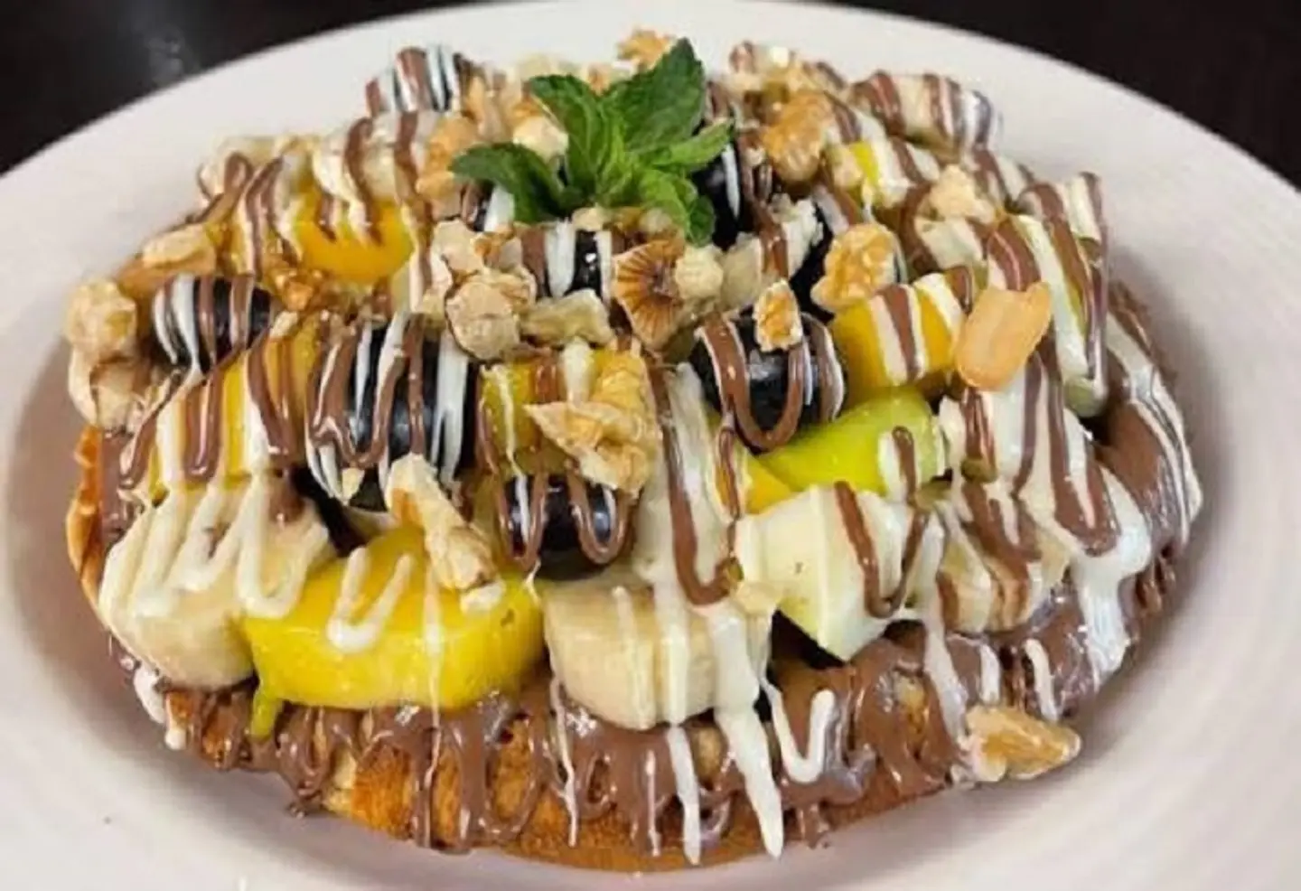 Waffle With Mixed Sauces And Fruits