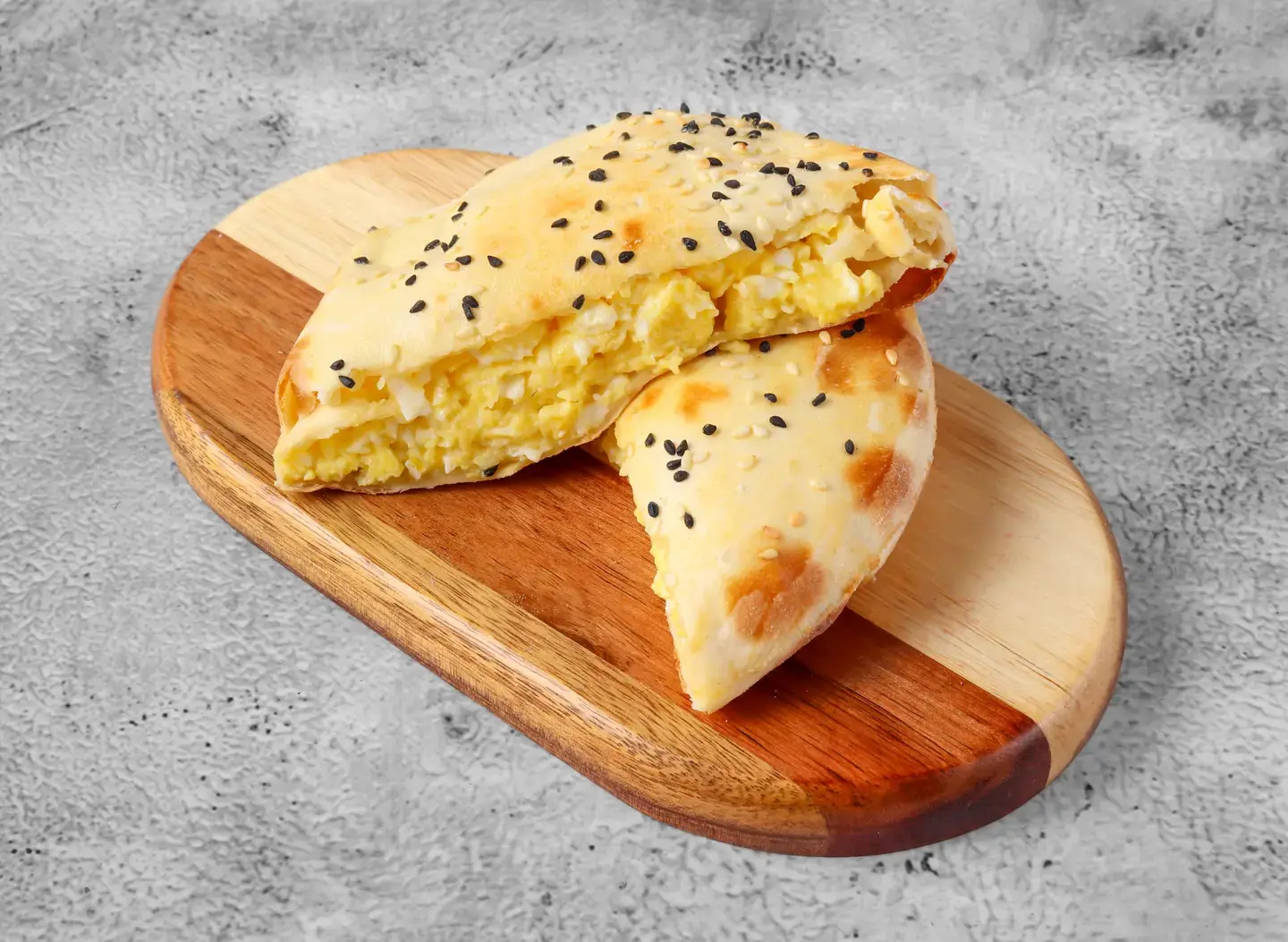 Fried Egg Sandwich In Round Bread With Cheese