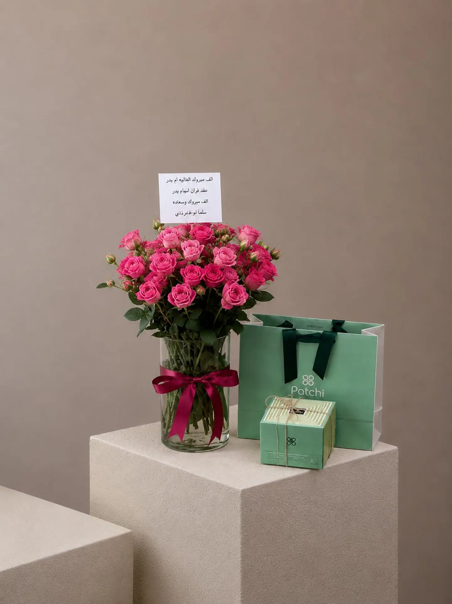 A Vase Of Roses And Patchi Chocolates
