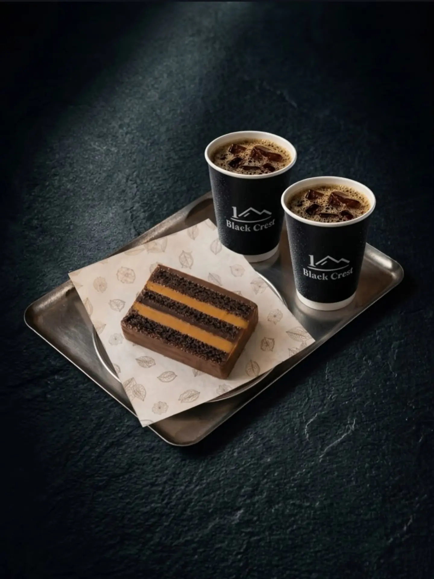 London Chocolate Cake With Two Cups Of Brewed Coffee (Hot Or Iced)