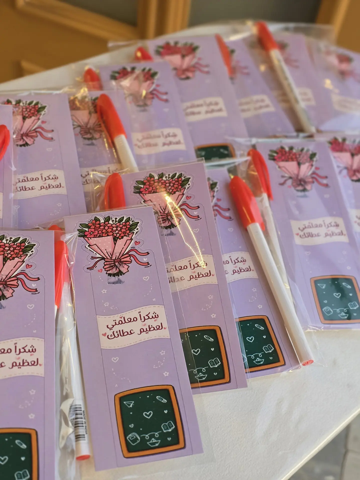Fountain Pens With A Card Bearing The Teacher's Day Logo