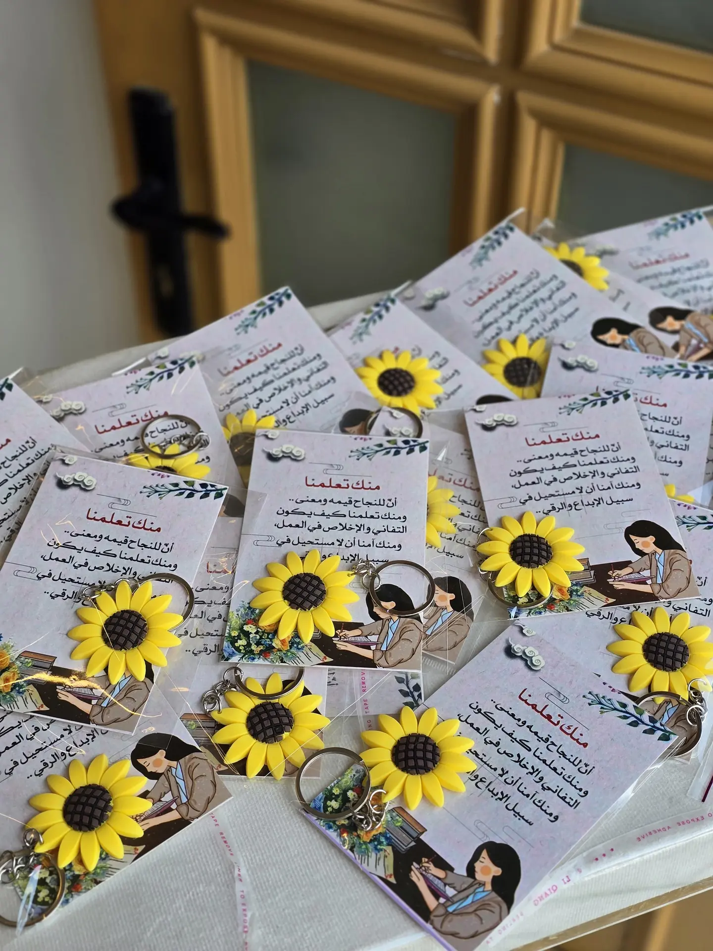 Sunflower Pendant With A Card Bearing The Teacher's Day Logo