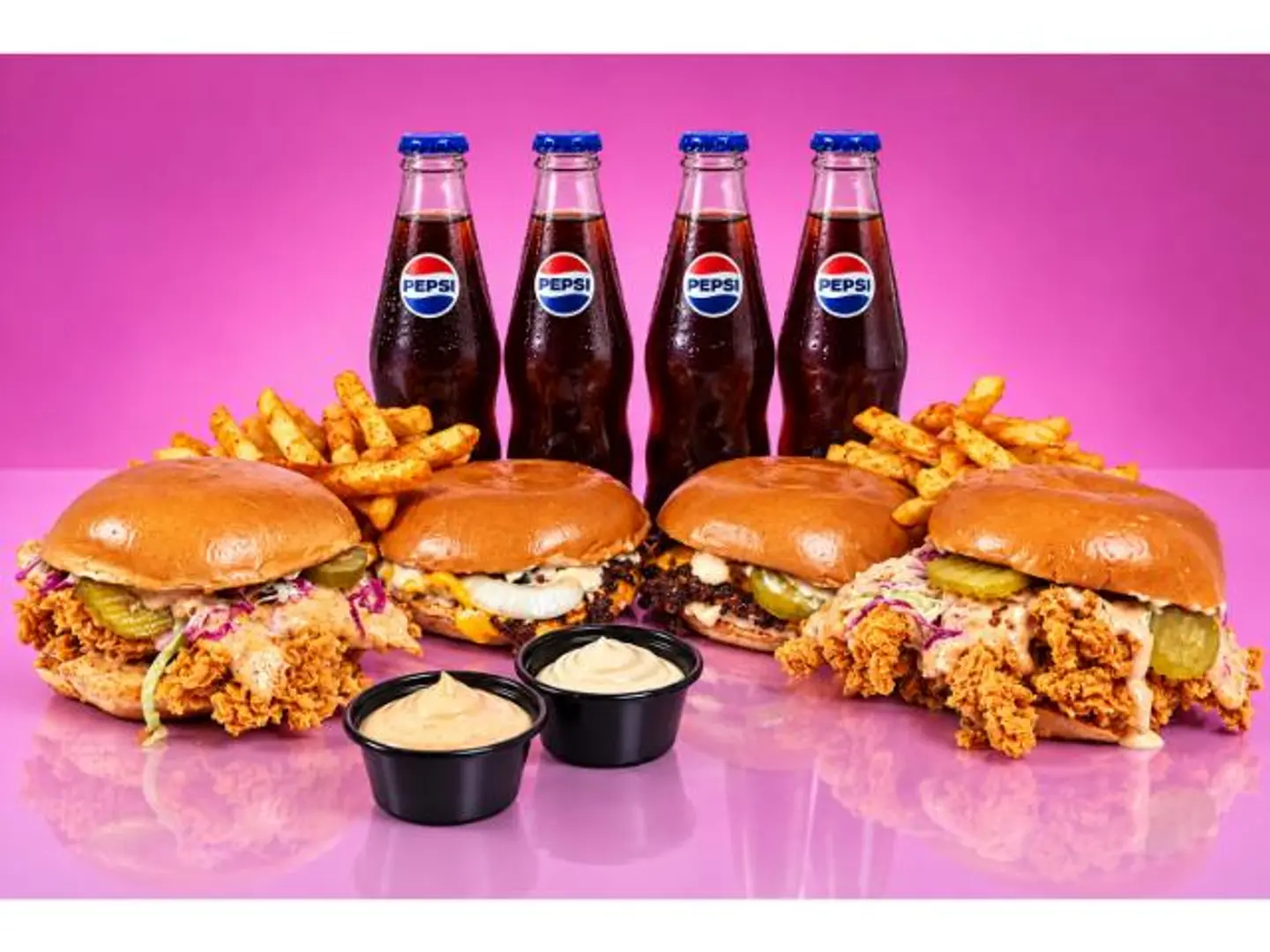 2 Double Cheeseburgers, 2 Crispy Sandwiches, 4 Drinks, 2 Portions Of Fries And 2 Pink Sauce Packets