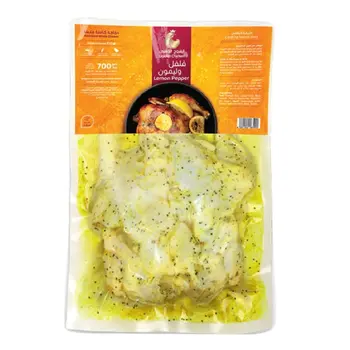 الفروج الذهبي دجاجة كاملة طازجة متبلة بالفلفل والليمون 700جرام